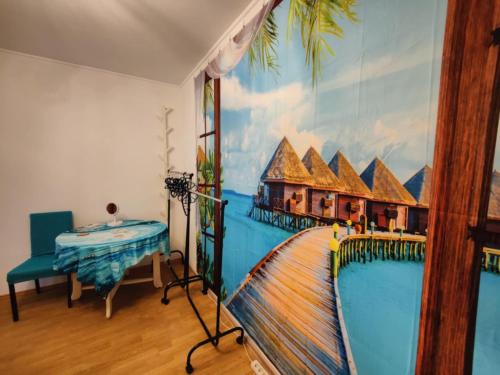 a room with a mural of a resort at Marija in Kaštela