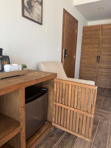 a room with a wooden desk and a door at Maple Resort in Santa Rosa