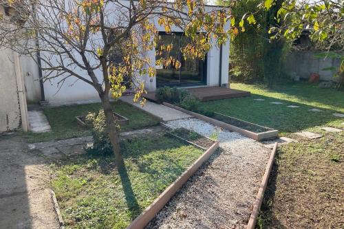 a small tree in the yard of a house at Bright house with garden in Saint-Sébastien-sur-Loire