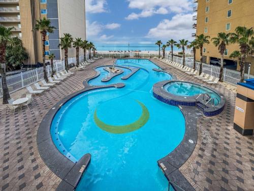 a swimming pool with two slides in a resort at Sunset Crossing in Gulf Shores