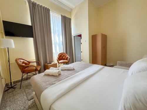 Ένα ή περισσότερα κρεβάτια σε δωμάτιο στο Vila club 011