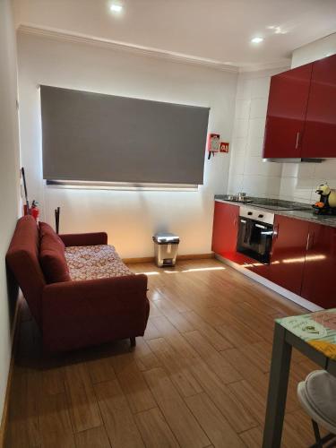 a living room with a couch and a chalkboard in a kitchen at D'OURO DOM MANUEL By LW in Vila Nova de Gaia
