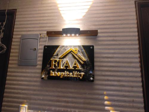 a sign on a wall that says fla hospital at FIAA Hospitality 3BHK 2 FLATS in New Delhi