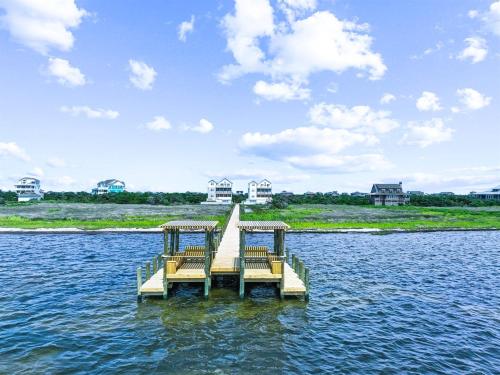a dock in the middle of a body of water at 8478 - Seas the Breeze II in Avon