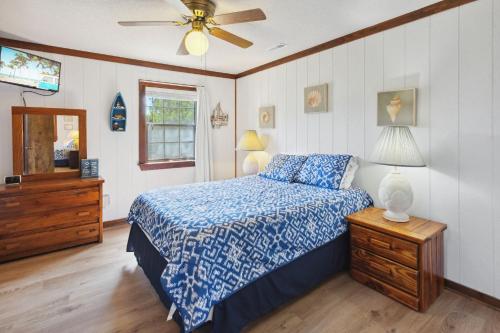 a bedroom with a bed and a ceiling fan at 2029 - Duck Yeah in Duck