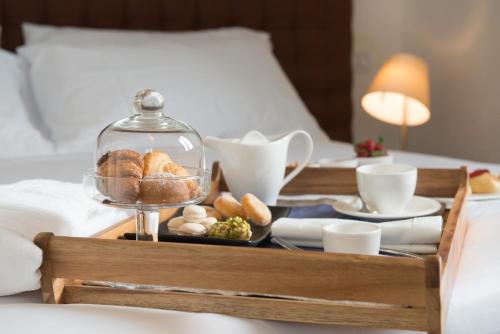 Letto o letti in una camera di Tenuta Duca Marigliano Boutique Hotel