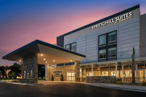 a building with a sign that reads survival suites at SpringHill Suites by Marriott Camden in Camden