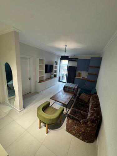 a living room with a couch and a table at Kobuleti One in K'obulet'i