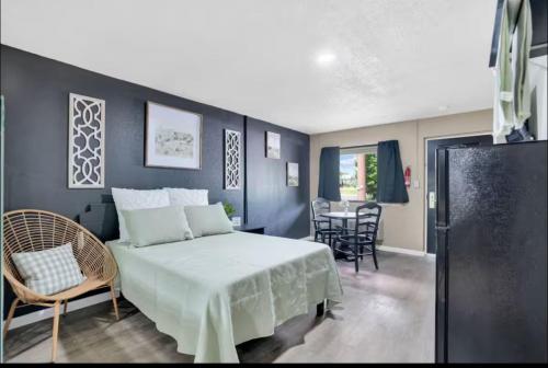 a bedroom with a bed and a table and chairs at Providence Place in Clarksville