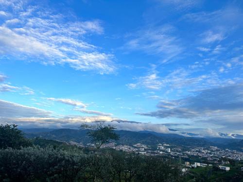 a view of a city with a blue sky and clouds at BALCÓN DE SANTA MARÍA 1 uno in Dosquebradas