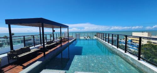 a swimming pool on the top of a building at #FLAT425 Get One - João Pessoa - Brasil in João Pessoa
