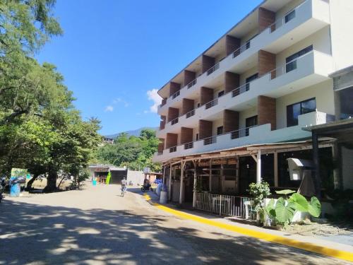 a building on the side of a street at Hotel Ventanas Al Paraiso in Agua Buena
