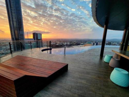 a view of a city from a building with a bench at Central Location and Splendid views in Brisbane