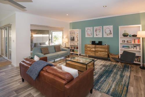 a living room with a couch and a table at Blue Retreat in Geographe