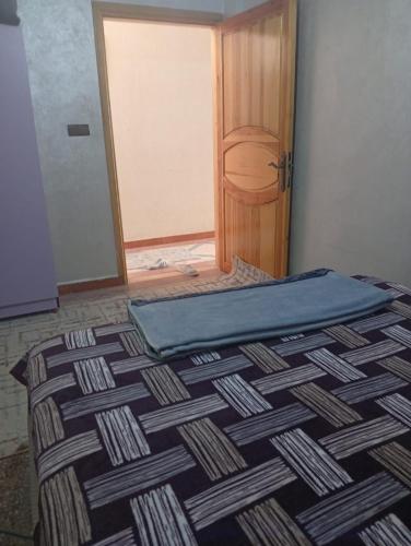 a bed in a room with a door and a door at Villa De Compagne 