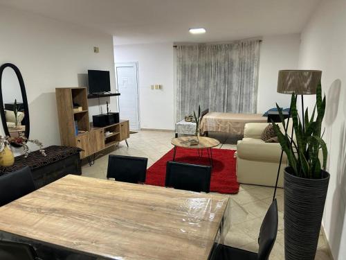 a living room with a couch and a table at Amplia Casa - Vista Verde in Villa María
