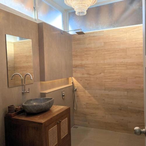 a bathroom with a sink and a mirror at The PD in Amed