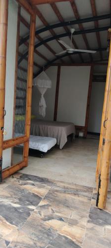 a tent with a bed in a room at Casa quinta con psicina in Estación El Salto