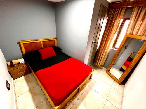 Postel nebo postele na pokoji v ubytování Hotel El Progreso - Económico, Central y Familiar en Armenia