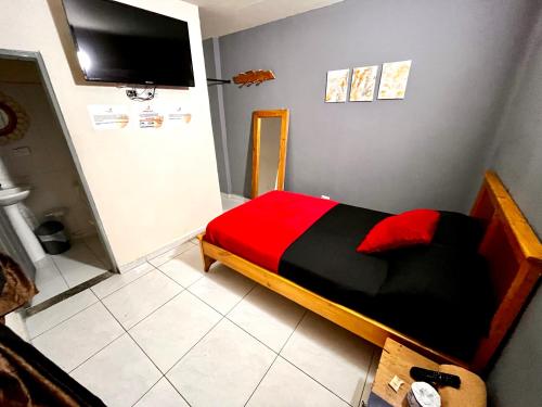 Postel nebo postele na pokoji v ubytování Hotel El Progreso - Económico, Central y Familiar en Armenia