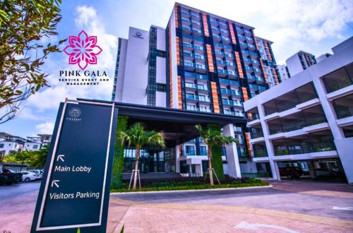 a sign in front of a large building at Timurbay Sidecation Studio - Walk to Beach, Enjoy Pool & Sea View by PG Management in Kampung Saberang Balok