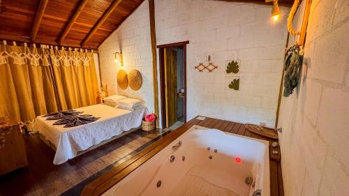 Cama o camas de una habitación en Pousada Reserva Setiba Guarapari