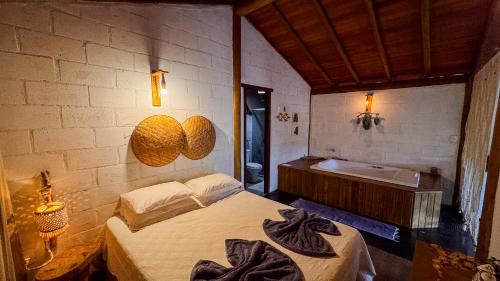 Cama o camas de una habitación en Pousada Reserva Setiba Guarapari