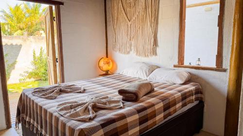 Cama o camas de una habitación en Pousada Reserva Setiba Guarapari