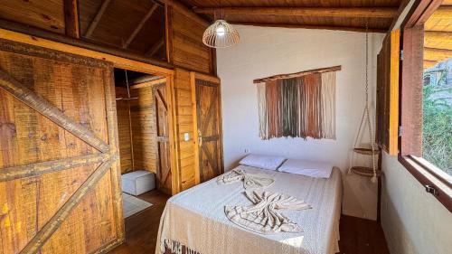 Cama o camas de una habitación en Pousada Reserva Setiba Guarapari