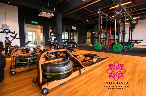 a gym with two treadmills and exercise equipment at Timurbay Sidecation Studio - Walk to Beach, Enjoy Pool & Sea View by PG Management in Kampung Saberang Balok