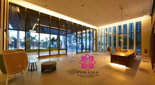 a lobby of a building with a pink flower on it at Timurbay Sidecation Studio - Walk to Beach, Enjoy Pool & Sea View by PG Management in Kampung Saberang Balok