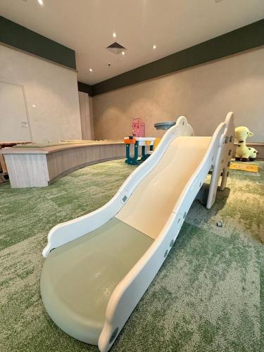 a slide in the middle of a room at Wyndham Ion Majestic Genting Highlands in Genting Highlands