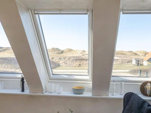 a window in a room with a view of the desert at 6 person holiday home in Vestervig in Vestervig