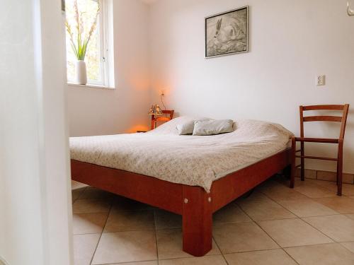 Ένα ή περισσότερα κρεβάτια σε δωμάτιο στο Nice holiday home on the water in Grou