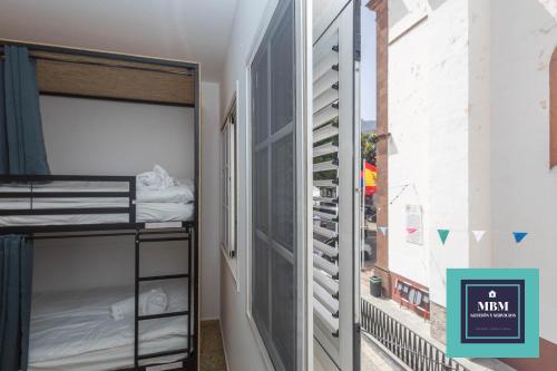 Postel nebo postele na pokoji v ubytování Albergue Casa Jalou