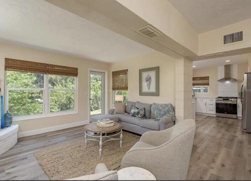a living room with a couch and a table at Retreat on the Bayou in Port Richey