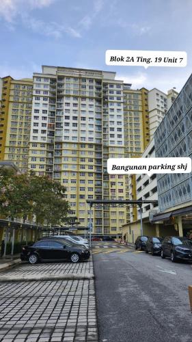 a parking lot in front of a large building at Sadiyra Homestay sebelah Alamanda Mall dan Tasik Putrajaya in Putrajaya