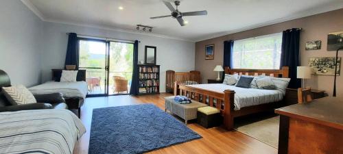 a living room with a bed and a couch at Misty River in Macksville