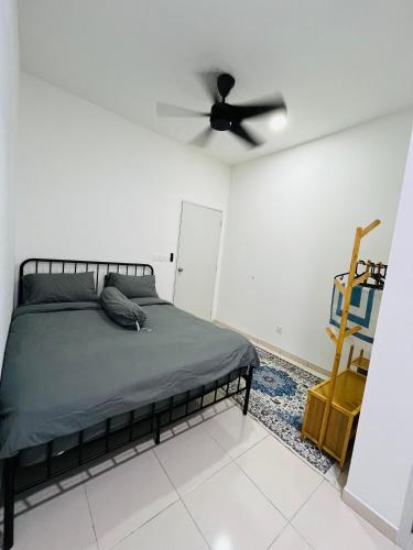 a bedroom with a bed and a ceiling fan at Landed KLIA Netflix, Fully AC&Heater, Kids Pool in Sepang