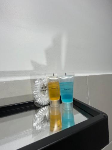 two glasses sitting on top of a table at Landed KLIA Netflix, Fully AC&Heater, Kids Pool in Sepang