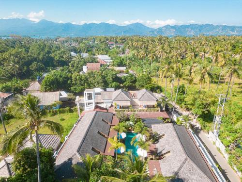 an aerial view of a house with a swimming pool at Villa Tahid in Gili Air