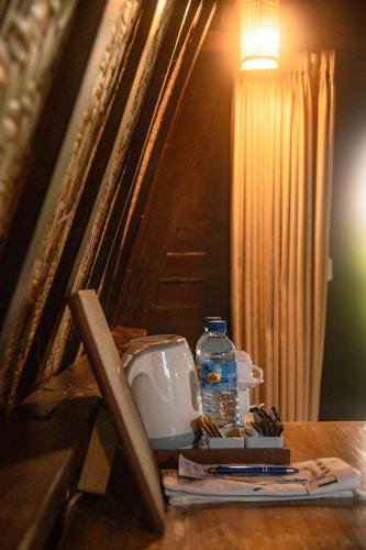 a bottle of water sitting on top of a table at Villa Tahid in Gili Air