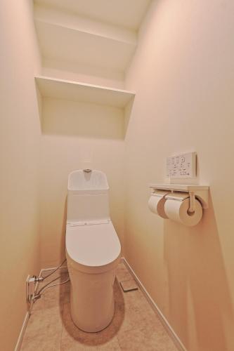a small bathroom with a toilet in a room at Steps from Shibuya Crossing B in Tokyo