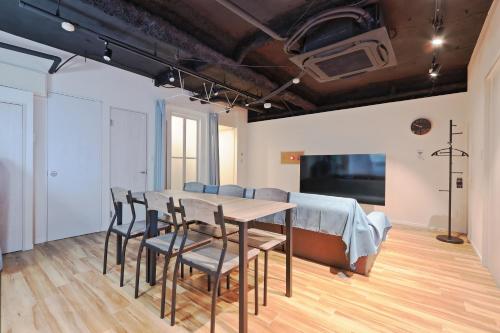 a dining room with a table and chairs at Steps from Shibuya Crossing B in Tokyo