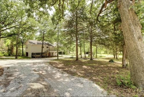 a campsite with a gravel road and trees at Oak St in Mountain View