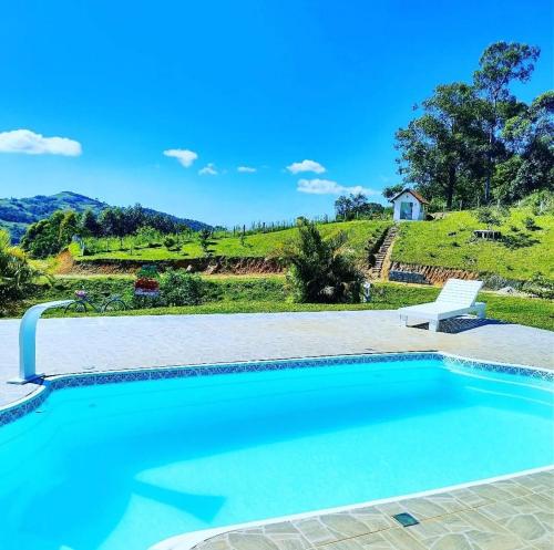 Kolam renang di atau dekat dengan Sitio Berebello cabana padrão