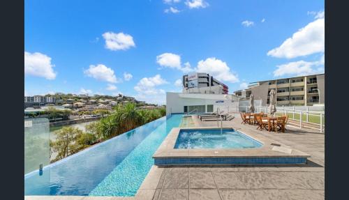 a swimming pool on the roof of a building at Apartment 1102 | 11th Floor River & Stadium Views in Townsville
