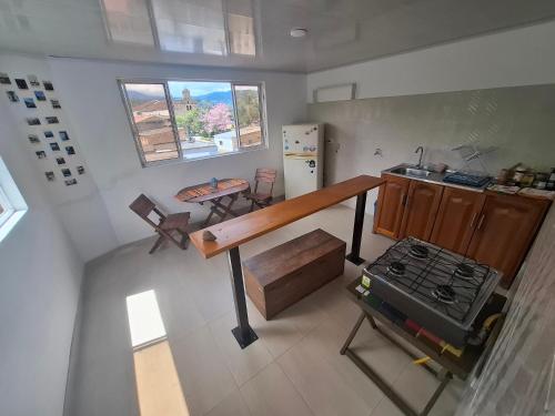 an overhead view of a kitchen with a stove at Penthouse - Altos de Iguaque in Gámbita