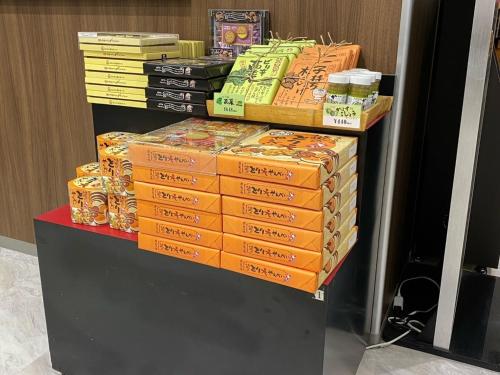 a stack of boxes sitting on top of a table at A&Bee HOTEL in Oita