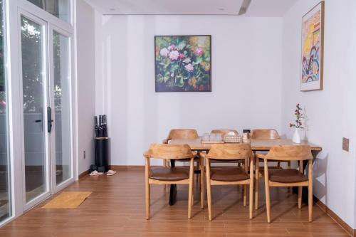a dining room with a table and chairs at Great Hotel Phú Quốc in Phu Quoc